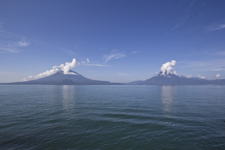 Panorama of the three volcanos that surround Lake Atitlan, Guatemalaの写真素材