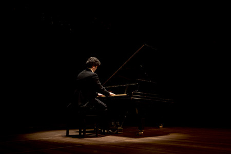 NITEROI, BRAZIL - APRIL 22, 2014: Brazilian pianist LuÃ­s Fernando Rabello performs his recital after a ten year gap. April 22, 2014 in Niteroi, Brazilのeditorial素材