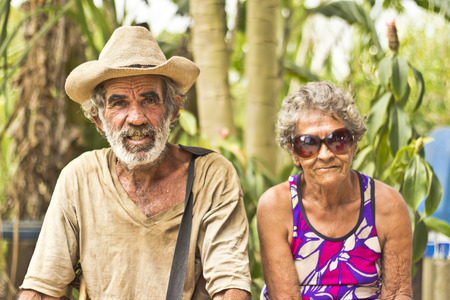JAPERI, BRAZIL - NOVEMBER 11, 2013: Elderly couple on a rural community rests while waiting the governmental ceremony for the issuance of land possession. November 22, 2013 in Japeri, Brazilのeditorial素材