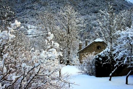 house in snow mountainの写真素材