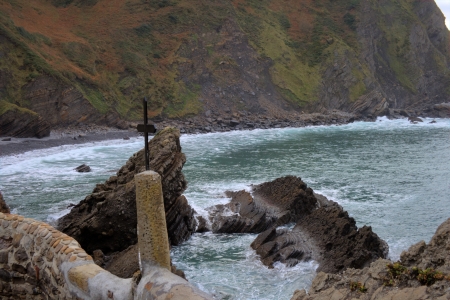 rocks on the coast with a crossの写真素材