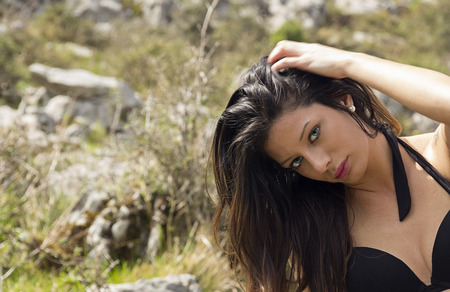 pretty brunette girl posing in natureの写真素材