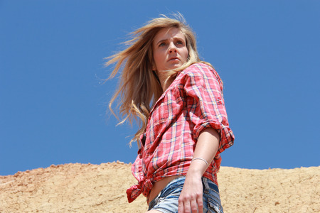 pretty girl posing in the desertの写真素材