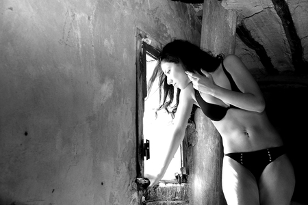 pretty girl posing in ruined townの写真素材