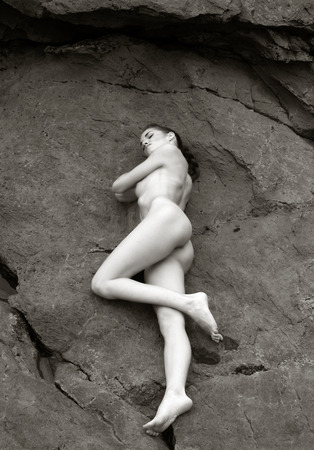 pretty girl posing naked in the coastの写真素材