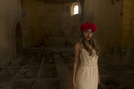 pretty girl posing in ruined townの写真素材