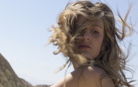 pretty girl posing in desertの写真素材