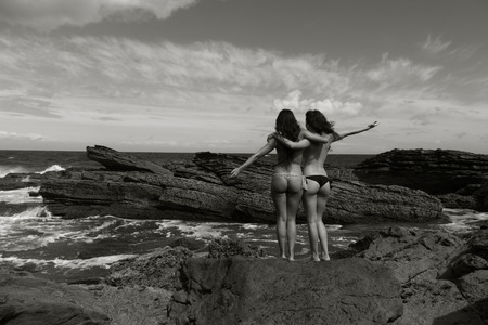 girls posing in the coastの写真素材