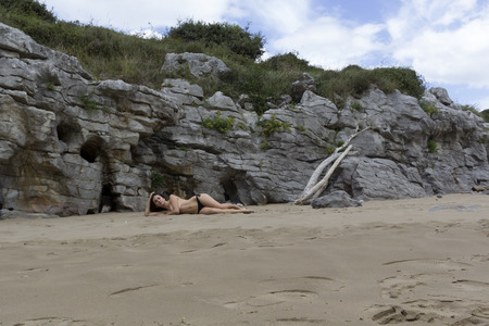 pretty girl posing in bikini in the coastの写真素材