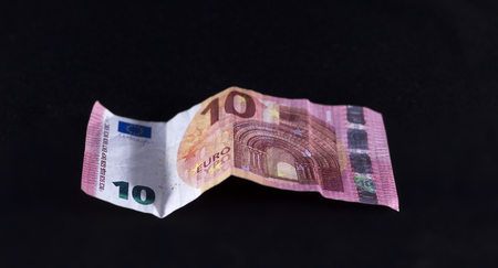Ten euro paper in black backgroundの写真素材
