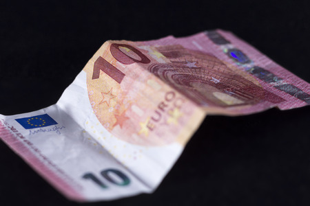 ten euro paper in black backgroundの写真素材