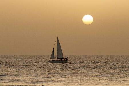 sail boat at sunset