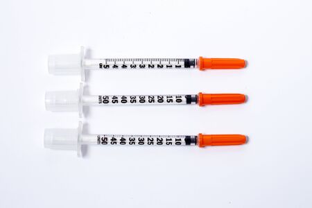 syringe over white backgroundの写真素材