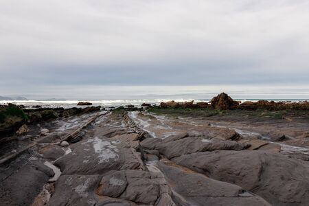 rocky beach in the basque countryの写真素材