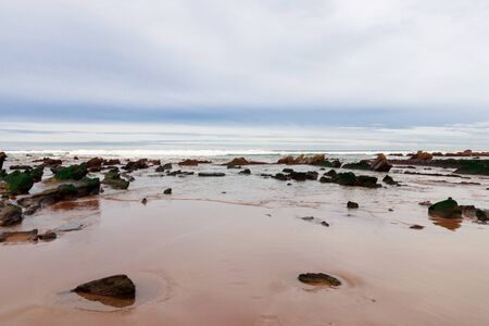 rocky beach in the basque countryの写真素材