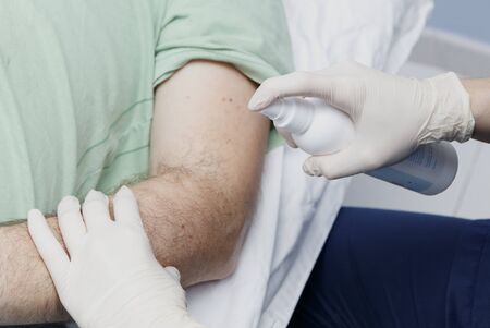 hands of a phisiotherapist making dry punctureの写真素材