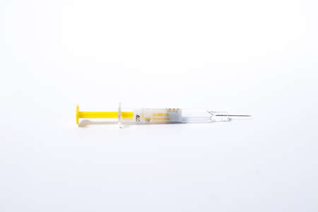 syringe over white backgroundの写真素材