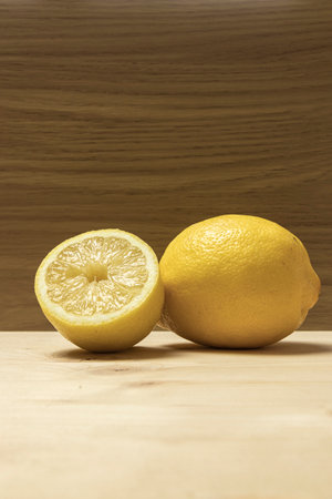 lemons over a brown tableの写真素材