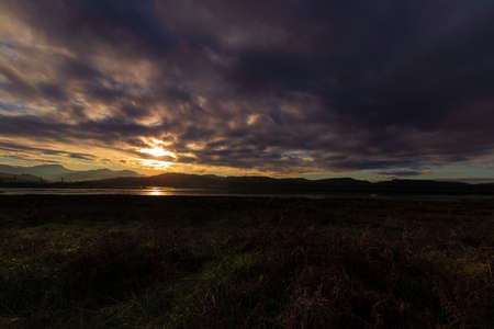 sunset in the water at the coast of laredo in the north of spain