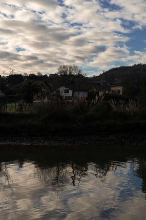 tranquil river in vizcaya in spainwith some clouds in the sky