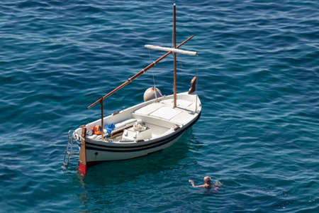 boat tourists on the costa brava on a sunny summer dayの写真素材