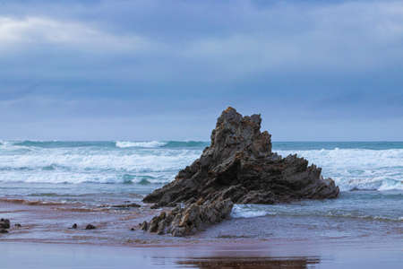 rock formation on the beach of sopelana, in the province of vizcayaの写真素材