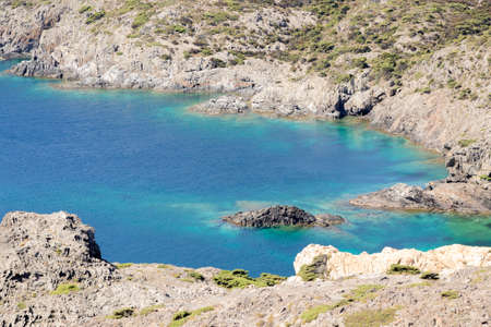 emerald colored bay in cap de creus on the costa brava in the province of girona a sunny summer dayの写真素材