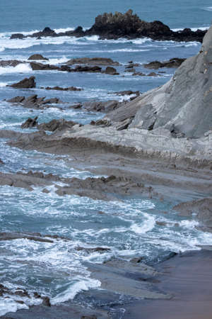 rocks on the coast of the Basque country in the village of Sopelana on a winter day