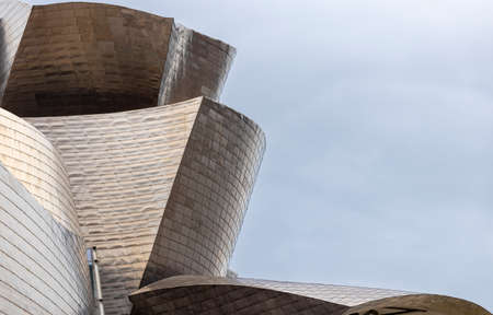 detail of the facade of a museum of modern titanium art in the spanish city of bilbao