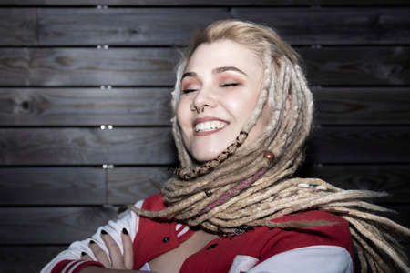 blonde woman with rolled dreadlocks