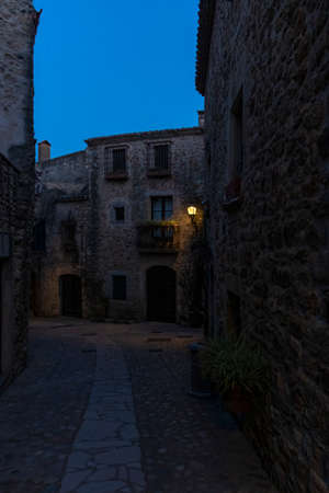 stone street in the medieval village of pals at night