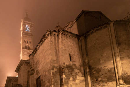 Mudejar church in the town of Tarazona in Spain on a foggy nightの写真素材