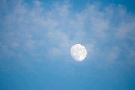 full moon in a blue skyの写真素材