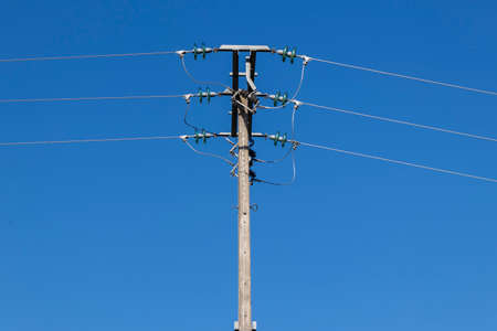 electric pole with a blue sky