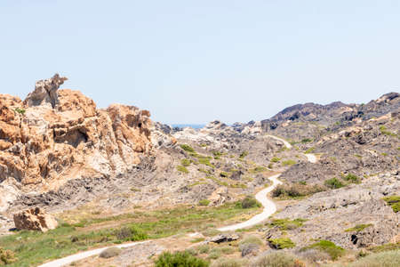 lonely road through cap de creus a hot summer dayの写真素材