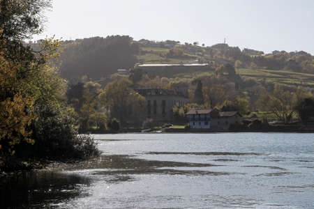 mansion on the banks of the river in lekeitio a sunny day
