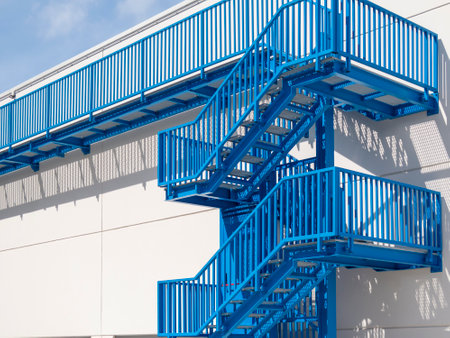 blue fire escape in an industrial buildingの写真素材