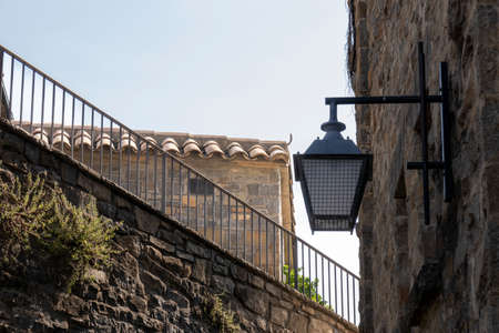 lantern on a stone facade in the town of ainsa
