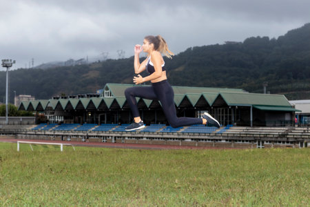 sporty woman jumping while training in a sports center