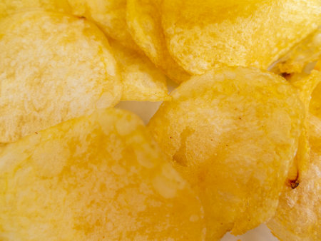 snack texture background with crispy potatoesの写真素材
