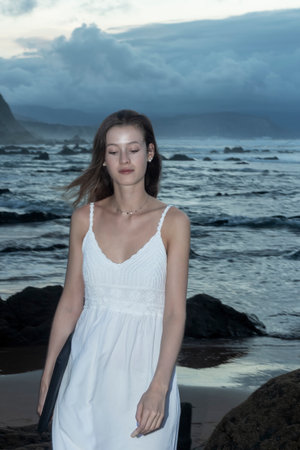 Young woman using laptop on a beach. freelance work conceptの写真素材