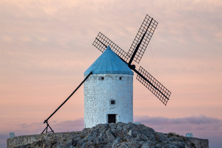 Rural Charm: Capturing the Rustic Beauty of Consuegras Windmills at Duskの写真素材