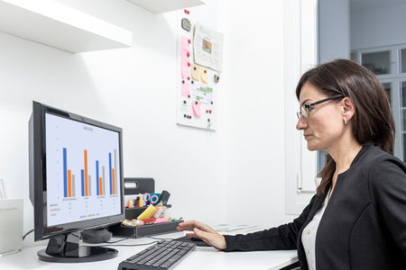 mature business woman telecommuting from homeの写真素材
