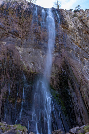 Ason Rivers Majestic Waterfall: Discovering the Serene Beauty of Cantabrias Natural Wonderの写真素材