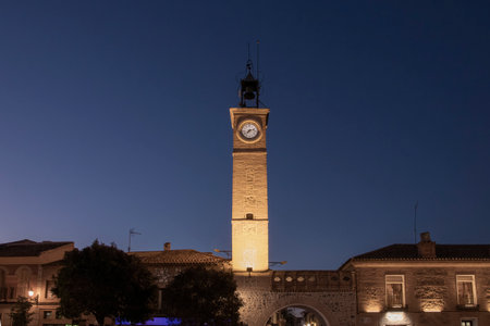 Glimmers of History: The Enchanting Nighttime Glow of Consuegras Church Bell Tower in Toledoの写真素材