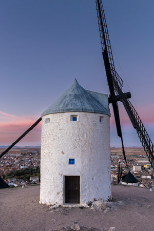 Serene Beauty of the Consuegra Windmills at Twilightの写真素材