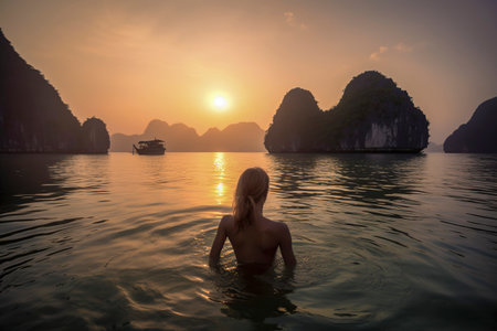 Seaside Serenity: Embracing Tranquility as a Woman Immerses Herself in a Southeast Asian Bayの素材