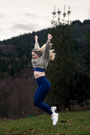 Beauty Leaping with Delight: Capturing Joy in the Mountainの写真素材