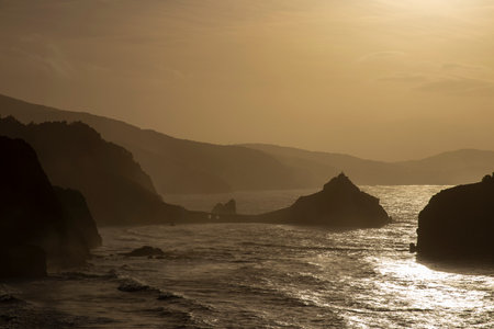 Serene Beauty Unveiled: Captivating Sunset at San Juan de Gaztelugatxeの写真素材
