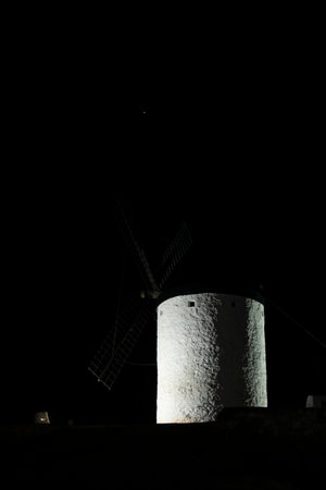 Cultural Treasures: Views of Consuegra's Ancient Windmills Adorned in Night Lightsの写真素材